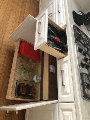 The drawers under stove were originally just face plates, dead/unused space... Mark put functional drawers there, they're super useful.