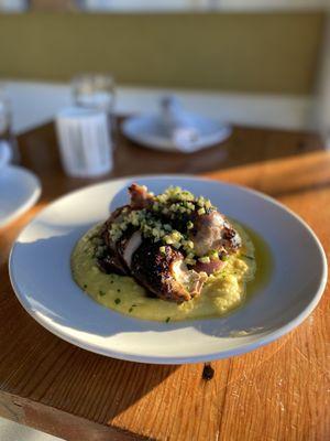 Enjoy our delicious Half Chicken, with creamy mascarpone polenta, caramelized red onion, and topped with a green apple and habanero zhug.