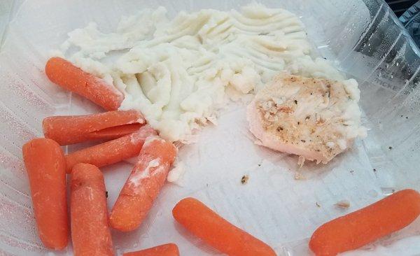 Lunch.. chicken breast,  mashed potatoes,  carrots, vanilla pudding,  milk and iced tea