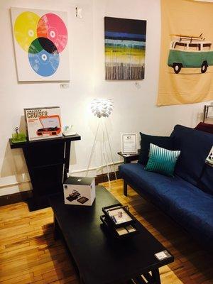 Futon, coffee table, console table, lamps, accessories & wall art