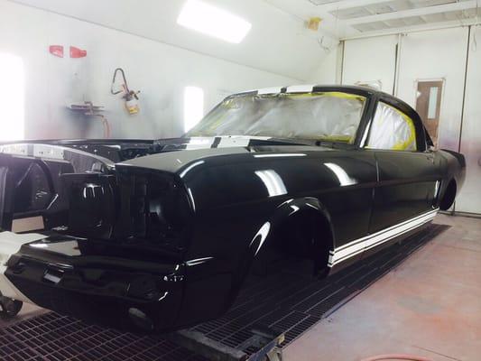 A 1966 mustang being painted.