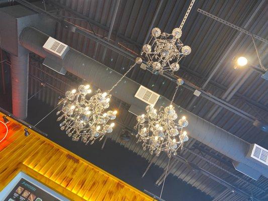 interior - eclectic decor! shipping containers, tailgates and chandeliers!