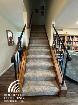 Stairway carpeting to first floor LVT transition