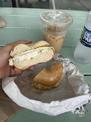 Sesame bagel with egg and scallion cream cheese, latte with honey and cinnamon