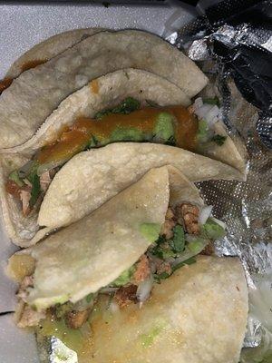 Pollo Asado Taco, Carnitas Taco, a Al Pastor Taco with red and green salsas