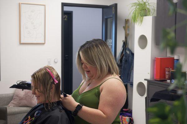 Jess doing a haircut on a client