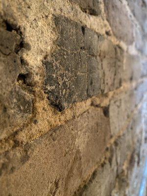 The brick work inside the restaurant and besides the tables. Beautiful