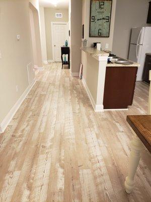 Mannington Restoration laminate gave this condo a relaxing beachy feel!