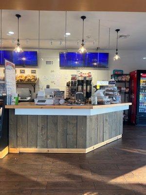 The register area of the shop, besides bagels, they have pastries, cookies, muffins.