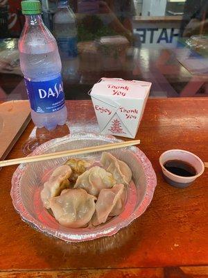 Pan fried pork dumplings and white rice. The house made dumpling sauce is fantastic!