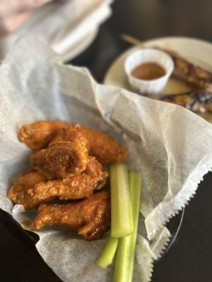 Buffalo wings and lamb skewers