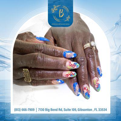 Transform your winter look with the enchanting charm of blue art nails, a perfect blend of elegance and frosty flair!