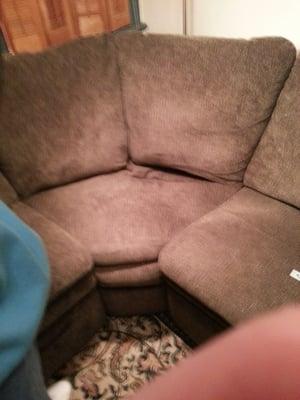 This is the corner section.  It's hard to see the crater but you can see the whole corner is lower than the rest of the sofa.