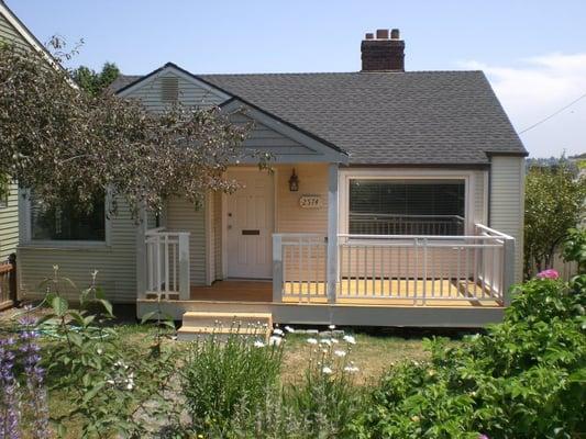 New covered porch, and cedar deck at this Magnolia Home