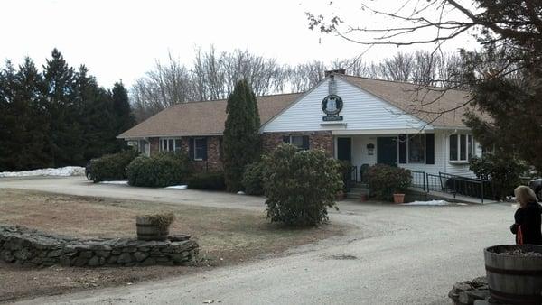 Front of building entering from driveway off of main road. Entry (w/ramp) on the right corner.