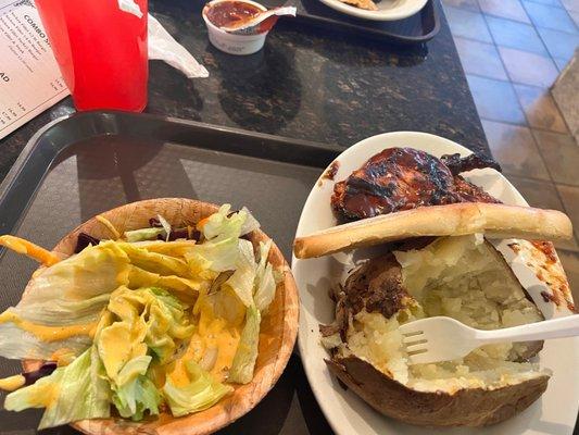 BBQ Chicken platter, salad baked Potatoe and Italian bread.