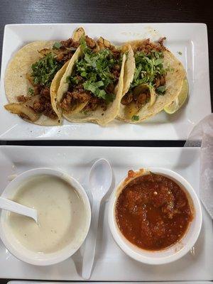 Seasoned pork tacos and queso with salsa