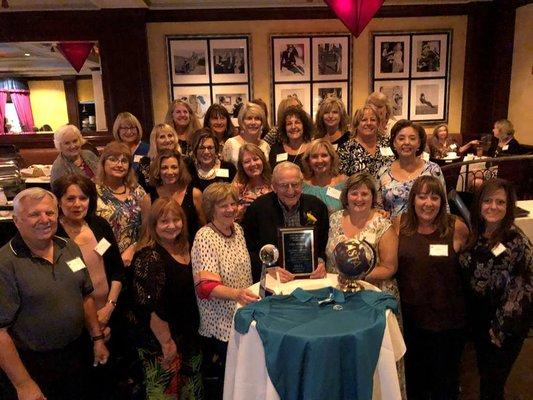 VP John Haskins presented Lifetime Achievement Award from ASTA (American Society of Travel Advisors). The staff celebrates.