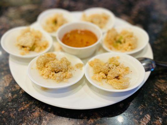 Vietnamese steamed rice cake - Topped with minced shrimp, pork rind chips, and scallion oil. Served with homemade fish sauce.