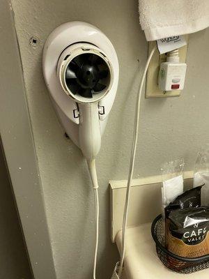 Broken hair dryer and holes in wall