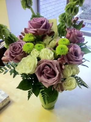 Lovely Lavender Bouquet - lavender roses, alstroemeria, white spray roses, bells of Ireland, green frosted vase. Photo by Vyvy.