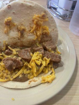 Carne guisada with cheese