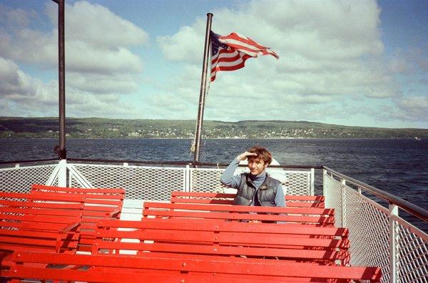 Me on ferry going to Madeline Island.  It is a coincidence that my hand and the American flag are both pointing to the north.