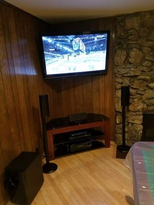 This game room just got upgraded with style. Corner mounted tv with wire concealment.