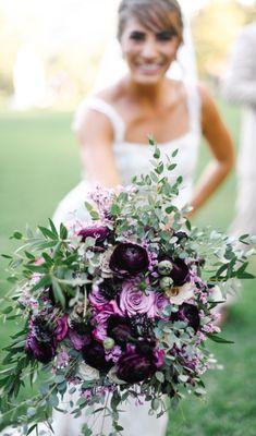 bride posing with bouquet