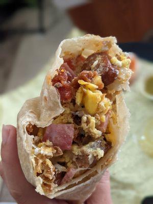 Sausage, ham, bacon breakfast burrito