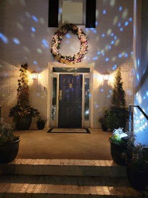 Beautiful, big lit wreath above the secured entrance to the property!