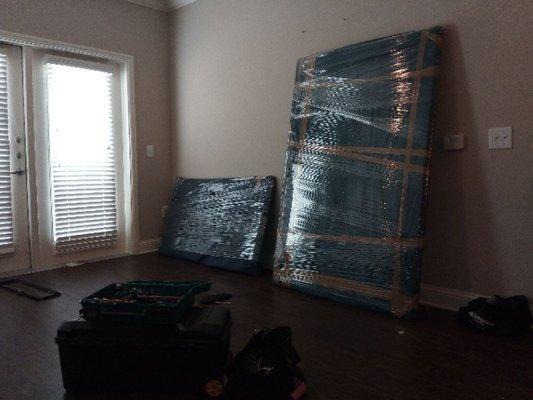 Padded and shrink wrapped furniture