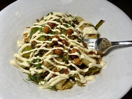 Warm Brussel Caesar with cashew milk, charred Brussels, crunchy chick peas.