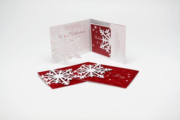 Intricate die cut with detailed fulfillment for a special holiday invitation.