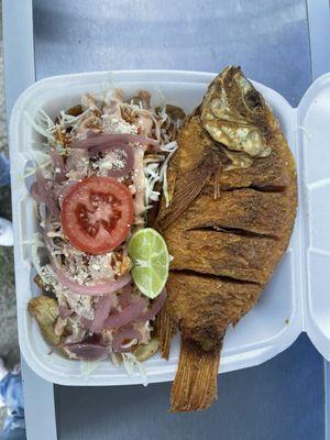 Fish fry with green plantains and cabbage side salad.