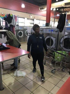 People walking around SHOWCASE laundromat on central ave n 12th street n Newark