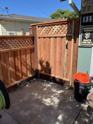 Front gate to rear property .. with enclosure for trash cans.