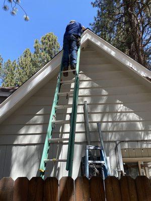 John pulling new cables to the roof