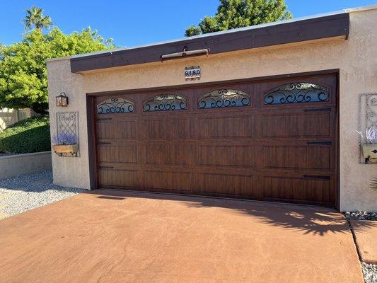 Clopay carriage house steel back steel front with frosted window with rod iron insert