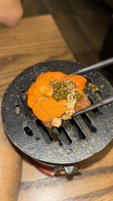 Stone grilled wagyu with uni, caviar, and gold flakes