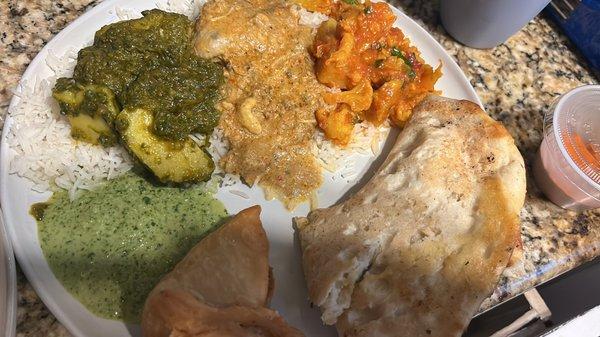 Aloo Gobi, chicken Korma, Saag paneer, garlic naan, and vegetable samosa