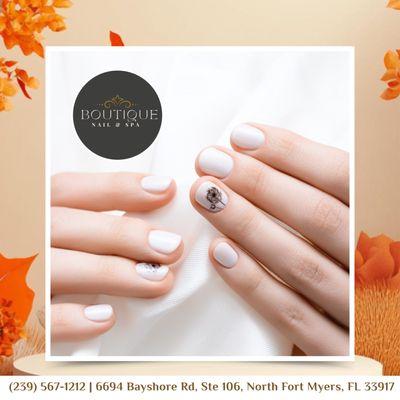 Embrace elegance with stunning white nails adorned with delicate floral art.