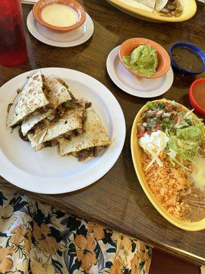 Fajita quesadilla with extra guacamole and cheese sauce