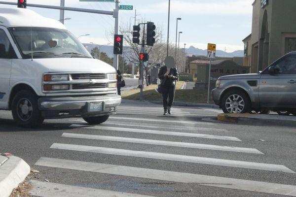 No cell phone while crossing a street and do not cross when it says NO