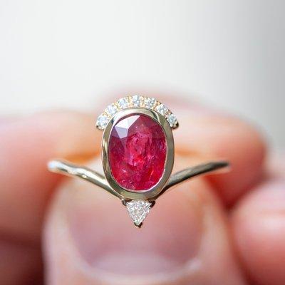 Oval ruby bezel set ring