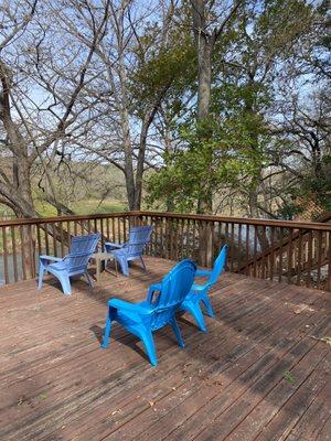 Lovely deck by the river. At night there are string lights!