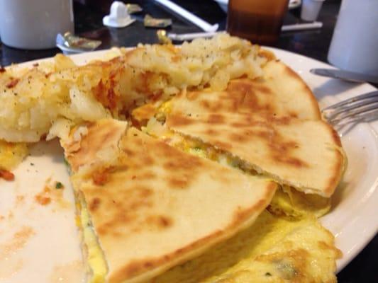 Breakfast Quesadilla (minus one slice). Not greasy! Just tasty!