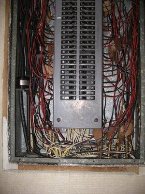 Just one of several electric panels that pose a fire hazard.  Fire trucks are there all the time.