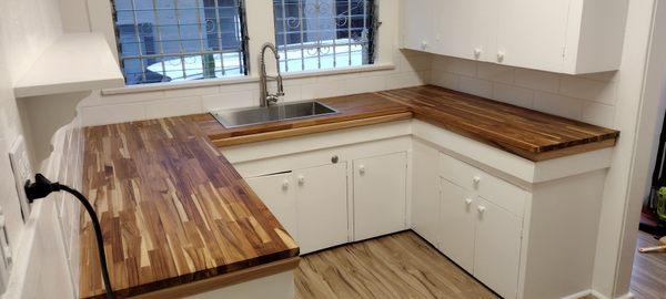 Remodeling a hold kitchen (countertop and backsplash), including the sink and the plumbing.