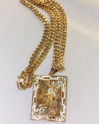 18k yellow gold diamond cut Cuban chain with a tiger pendant  - 156grams in weight.